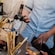 A Guest next to a table with a selection of Greek wines and grissini